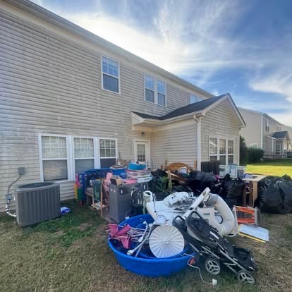 Backyard junk pile before removal in the Charlotte area
