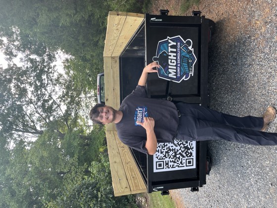 David, co‑owner of Mighty Dump and Demolition